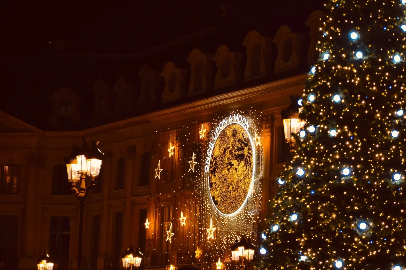 the Place Vendôme in Paris at night with Christmas lights